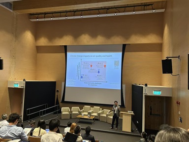Prof. Steve presenting a slide on climate change impacts on air quality and health at a conference.