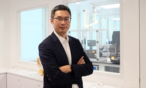 Prof Chen Xiaodong standing in front of a laboratory