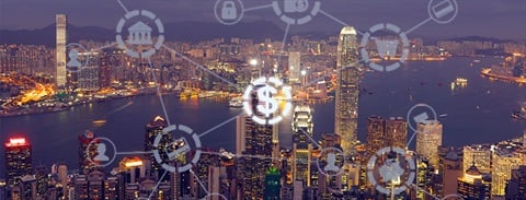 Graphic icons, with the dollar sign highlighted, over a city at night