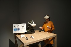 Wastelands: Artist Debbie Ding demonstrating use of VR headset