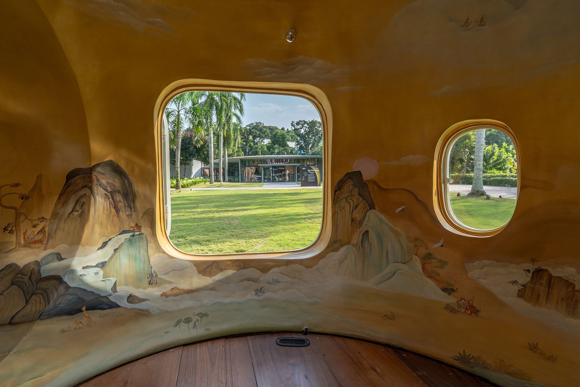 Installation view of Cosmos of Nostalgia by Torlarp Larpjaroensook, interior shot of handpainted walls and windows