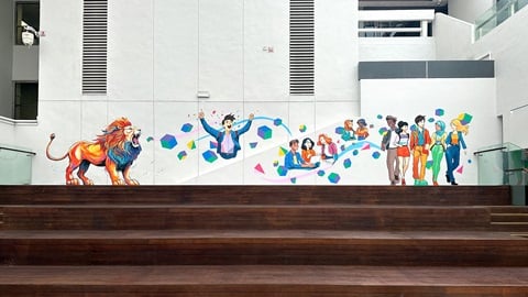 OneNTU Mural in full - A lion representing NTU on the left with various people to the right