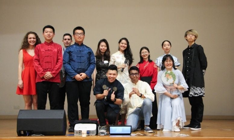 Group of students dressed in different cultural attires.