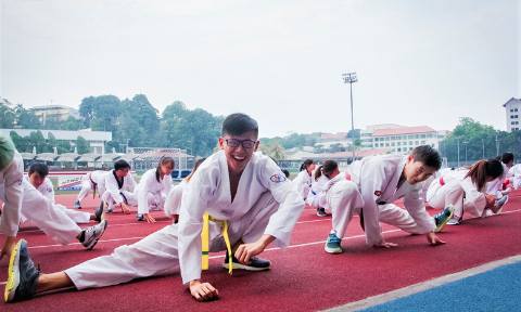 NTU Taekwondo club member enjoying himself during training with his clubmates