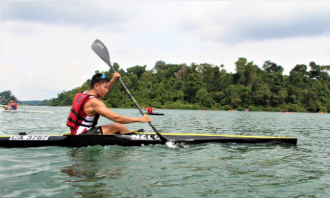 NTU Canoe Sprint male rower paddling in MacRitchie Reservoir
