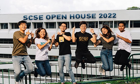 Image of undergraduates jumping in front of SCSE building.