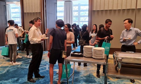 Photo of faculty interact with invited candidates.