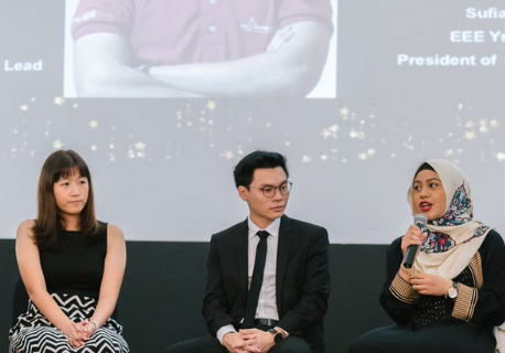 students having a discussion at an event