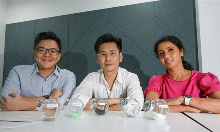 Group of 3 people showcasing fruit peels and precursors used for battery recycling