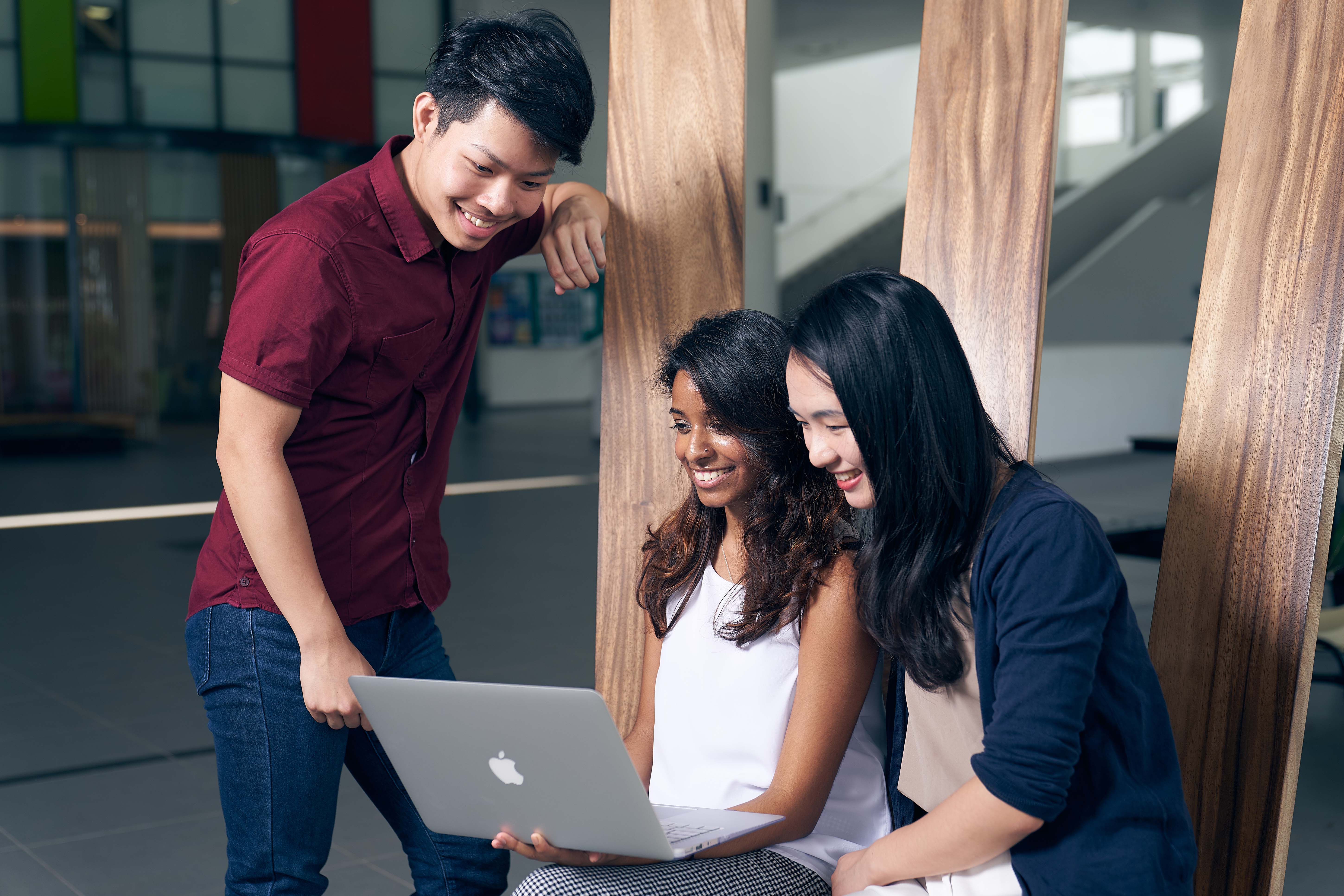 students looking at laptop