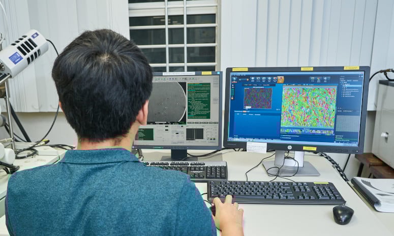 Researcher looking into computer