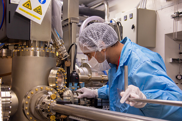 Researcher adjusting sample position