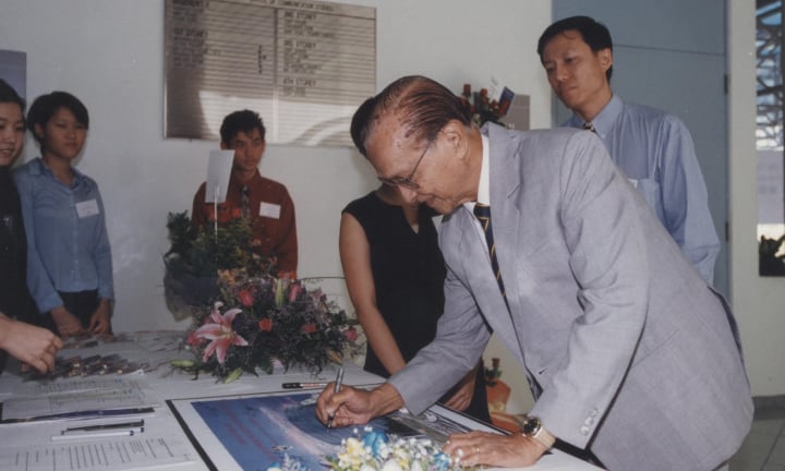 VIP signing at a formal event in the school
