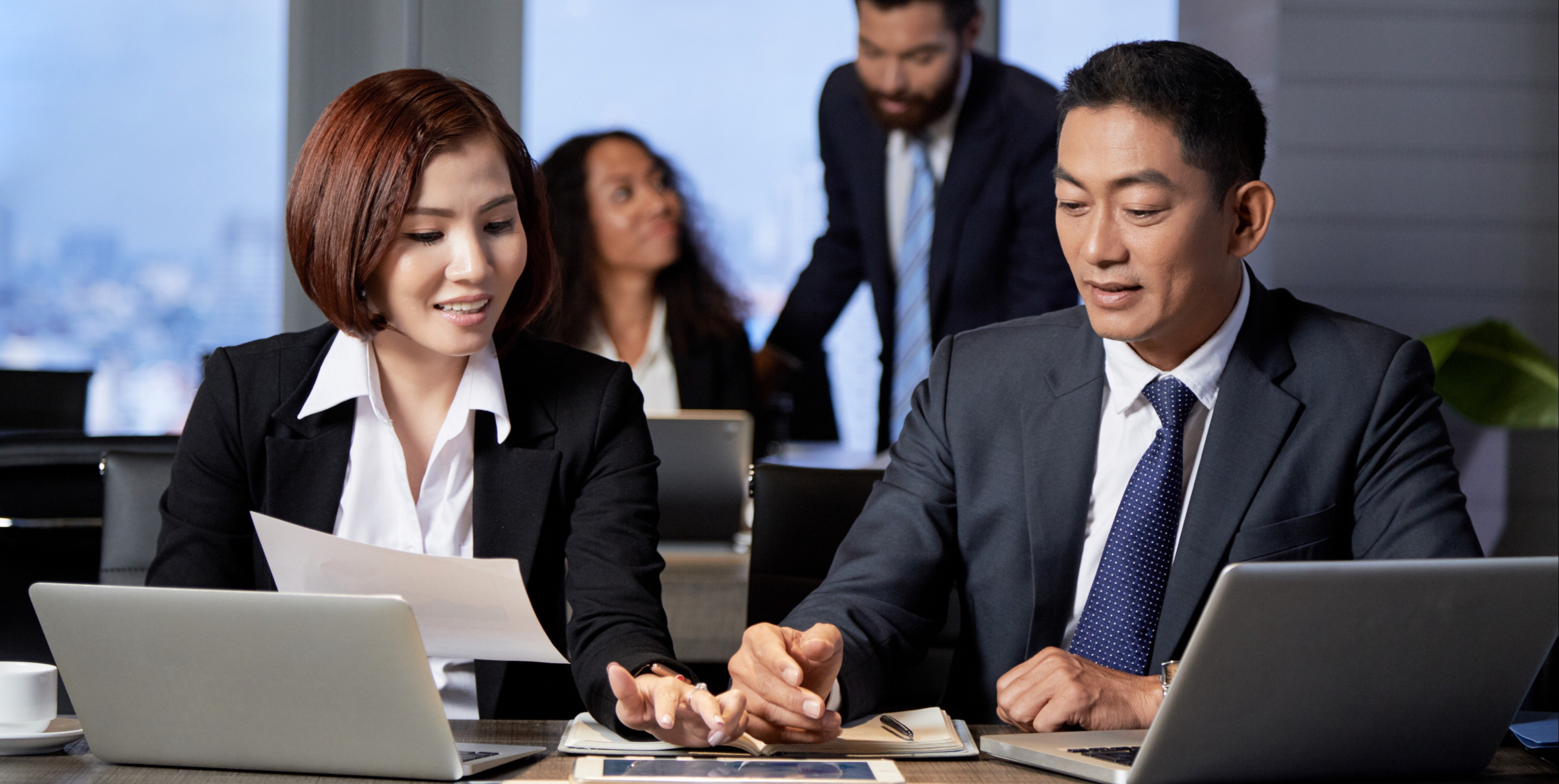 3. young-ethnic-coworkers-using-tablet