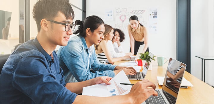 Students having a discussion in a physical class session.