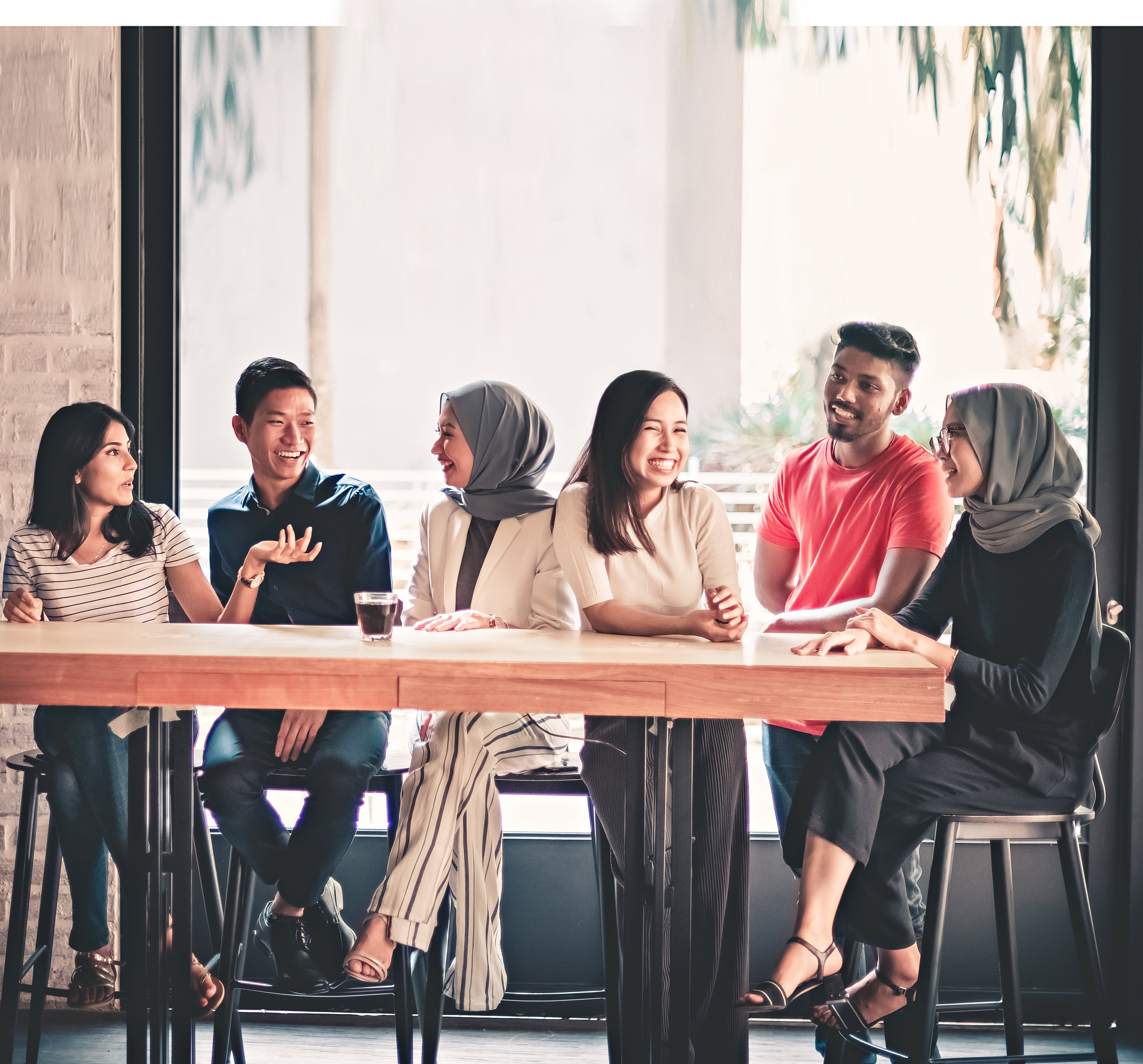 Students having a lively discussion on entrepreneurship in a learning studio