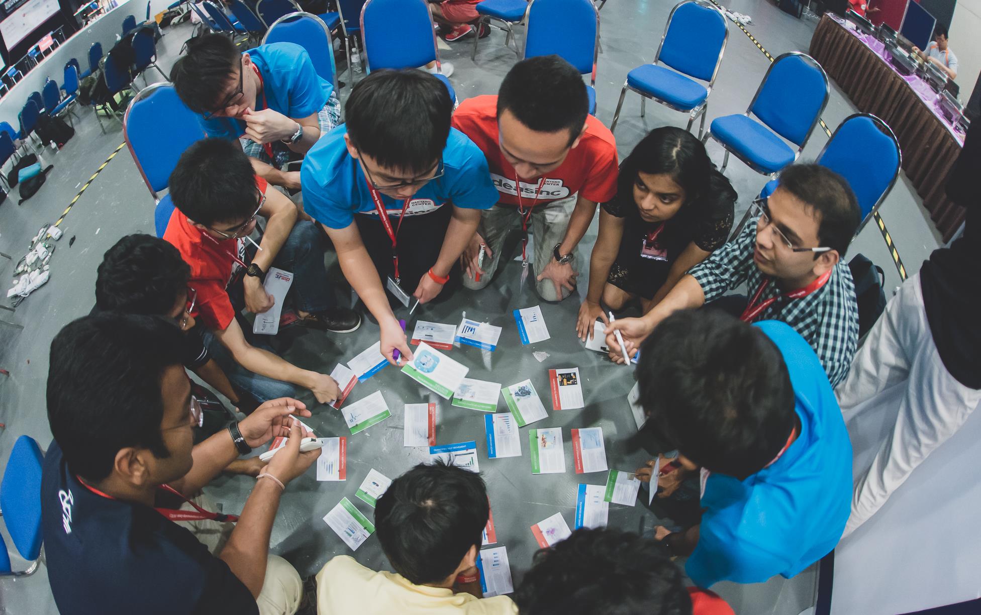 Participants from various backgrounds working together in a team activity.