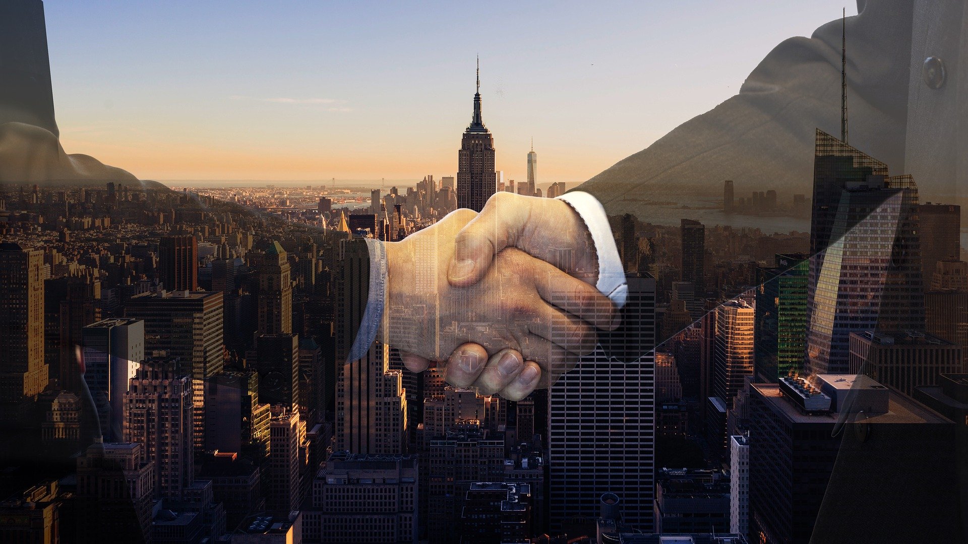 Business handshake in a global city