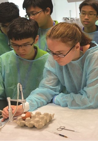 ISYF students doing experiment