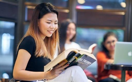 International Trading Programmes student reading a text book on social theory