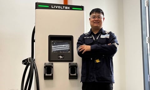 Tan Shi Jun (MAE) with EV charger