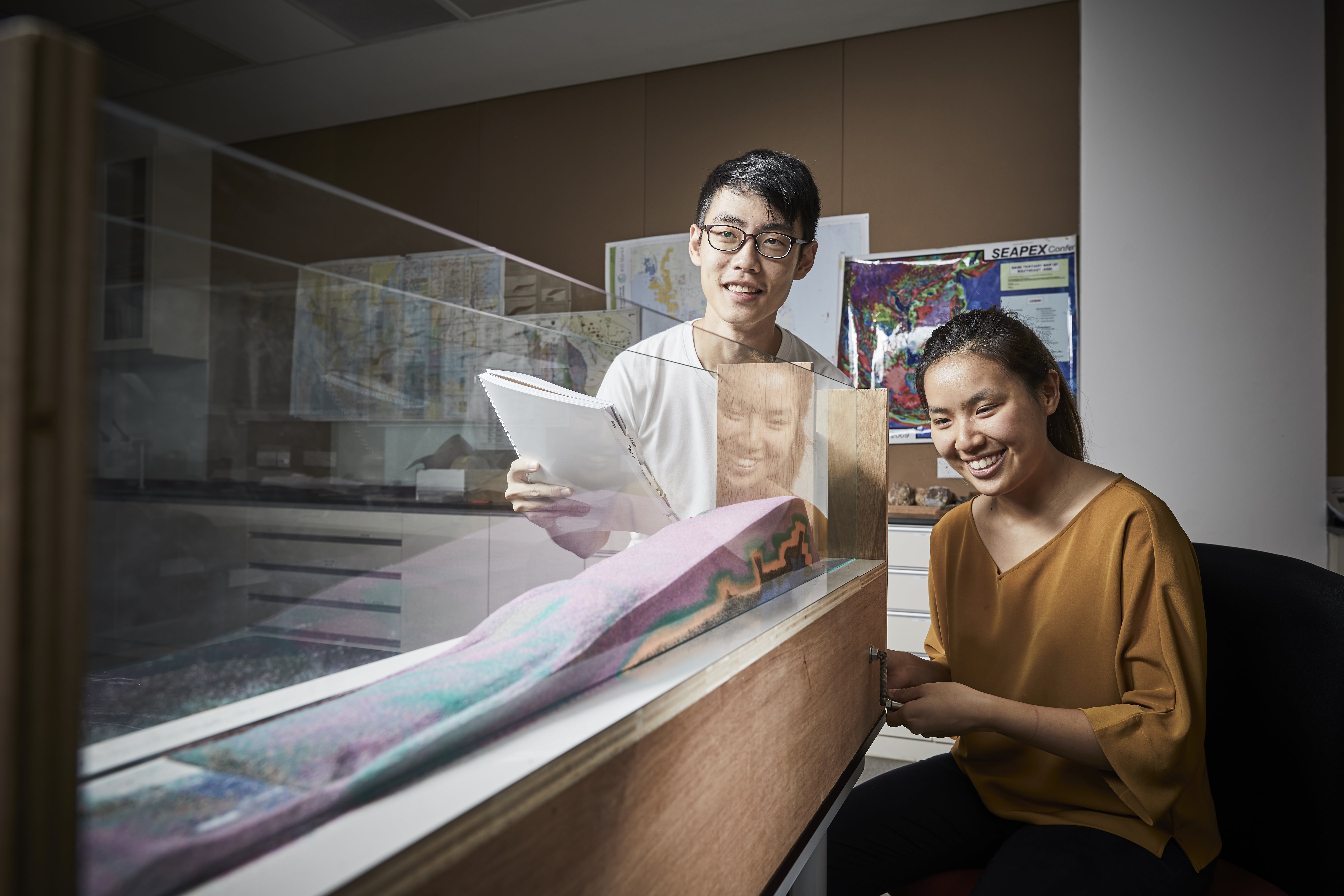 Two students conducting an experiment in ASE
