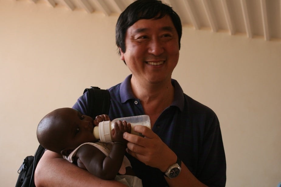 Prof Sung Feeding a Child