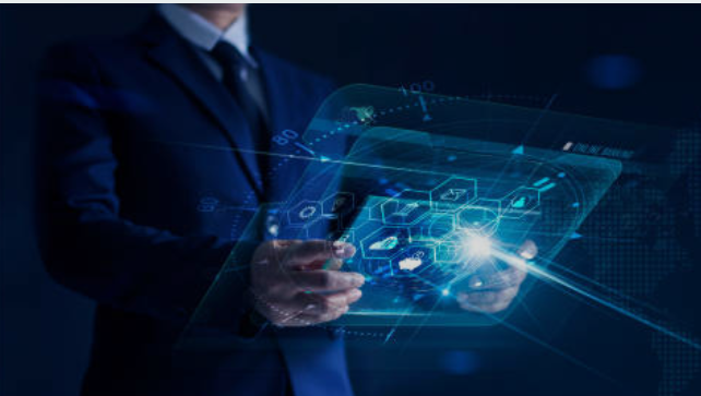 An NBS post-graduate looking at a futuristic tablet device