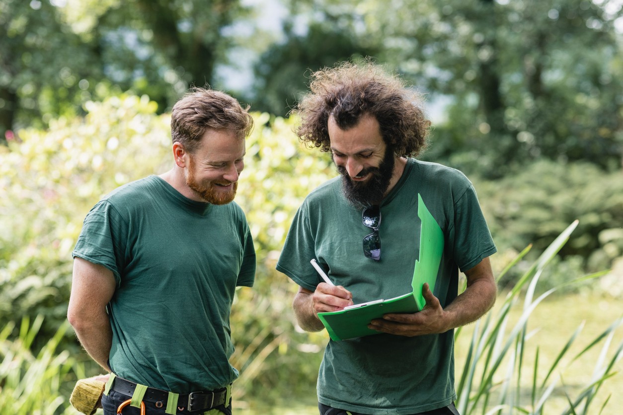 Men in green shirt at a grassfield