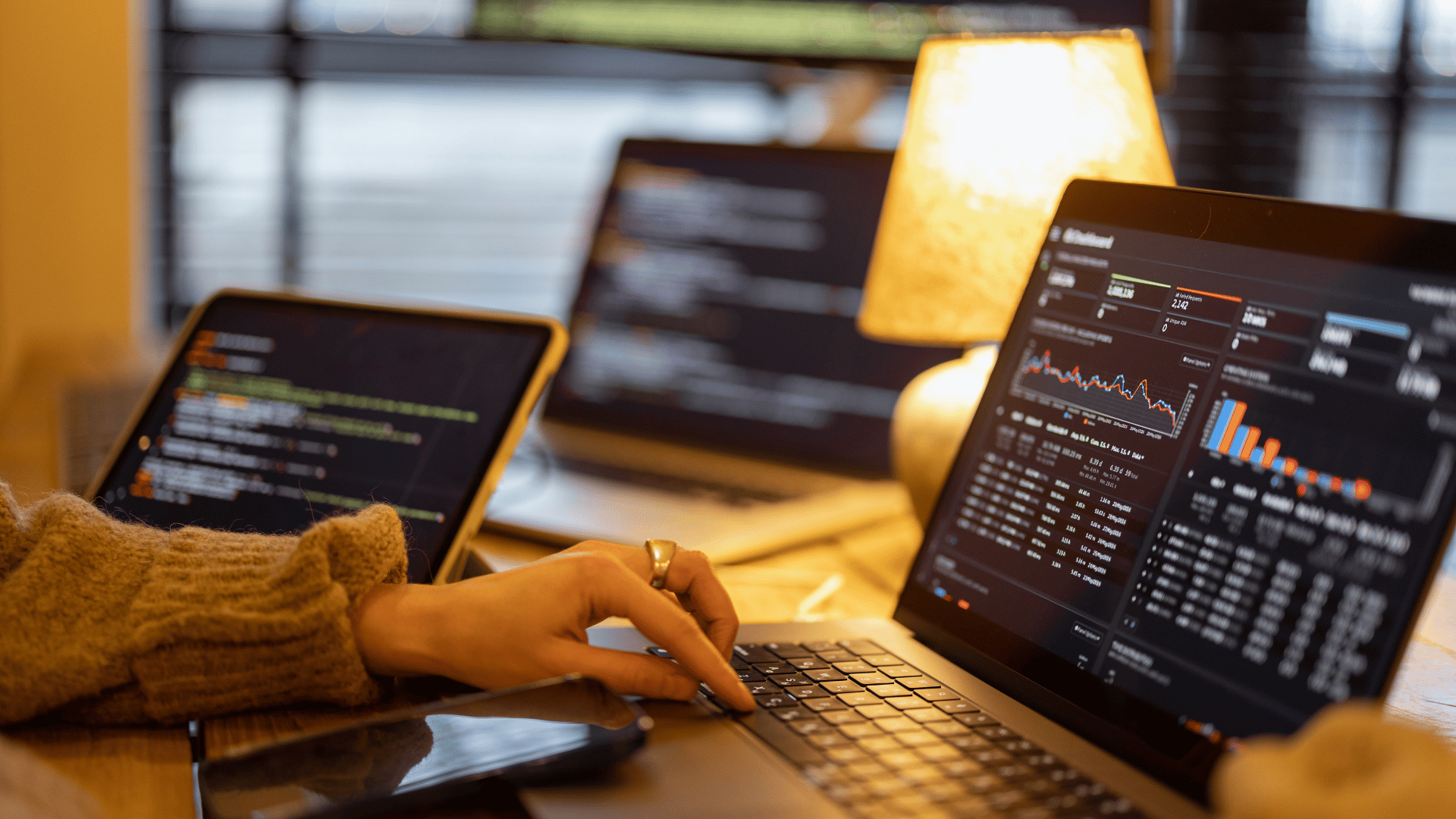 Financial graphs and software on a laptop