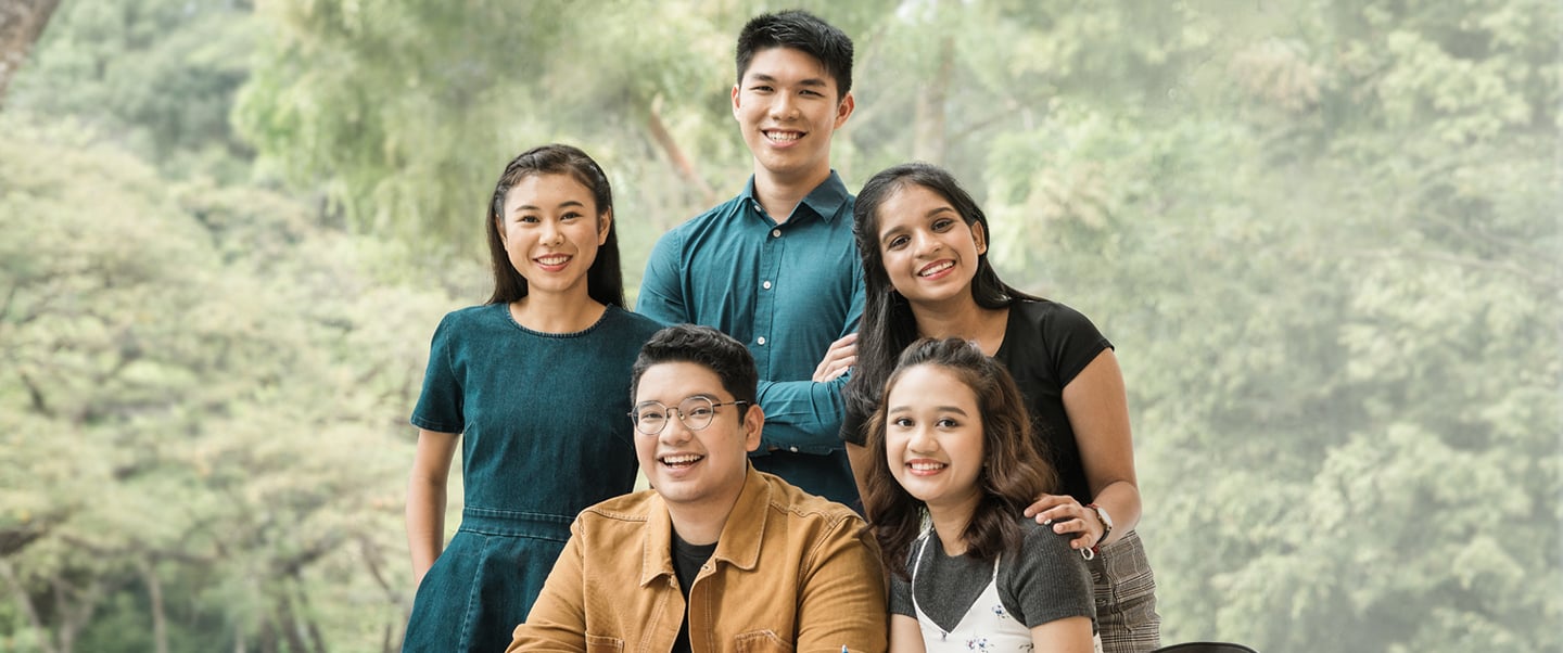 A Photo Studio Backdrop Of Trees and Group of 5 Diverse Students