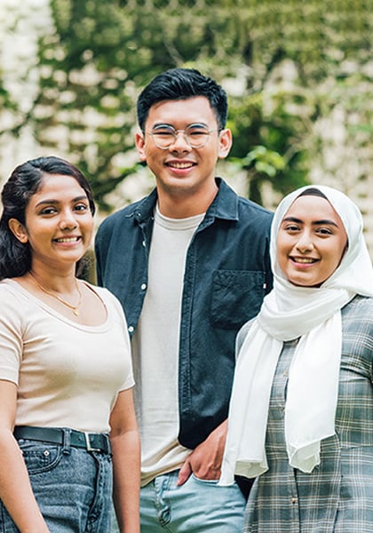 Smiling Group of 4 Young Students at NIE Campus Malay Girl White Tudung Grey GinghamTop (mobile)