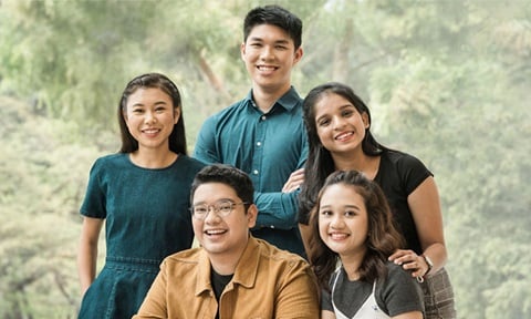 Smiling Group A Photo Studio Backdrop Of Trees and 5 Diverse Students Malay Girl Wearing White Dungaree (720x432px)