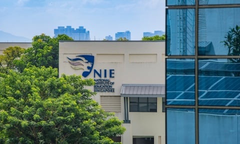 E - Main NIE Logo Building Blue Windows