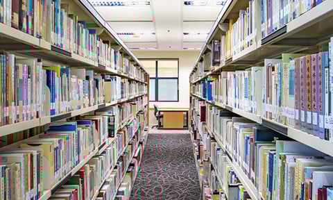 In Between Shot of Shelves of Books in a Library (480x288px)
