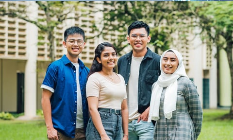 NIE staff smiling for photo