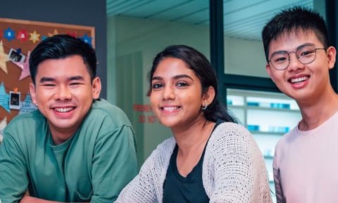 Smiling Group of 4 Young Adults Stars On Classroom Wall Malay Girl with Brown Tudung 2 (480x288px)