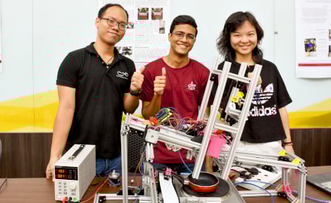 CN Yang scholars showing a prototype for cracking an egg